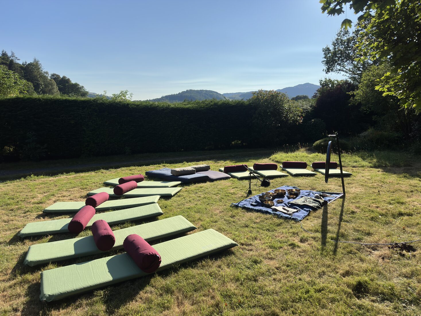 Outdoor sound bath setup overlooking the Perthshire hills